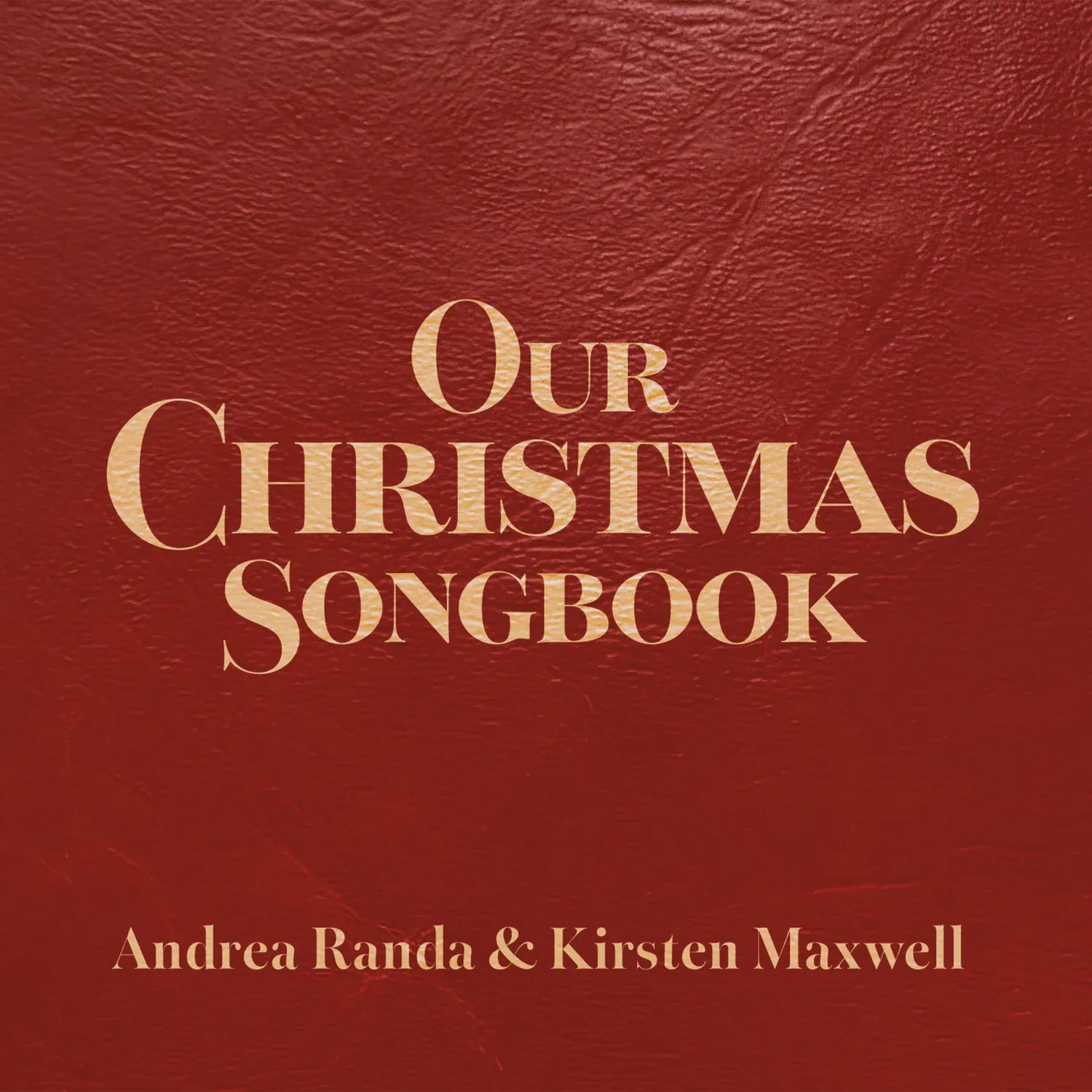 Our Christmas Songbook album cover: gold lettering on a deep red songbook, by Andrea Randa and Kirsten Maxwell
